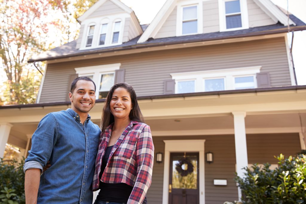 couple in front of home